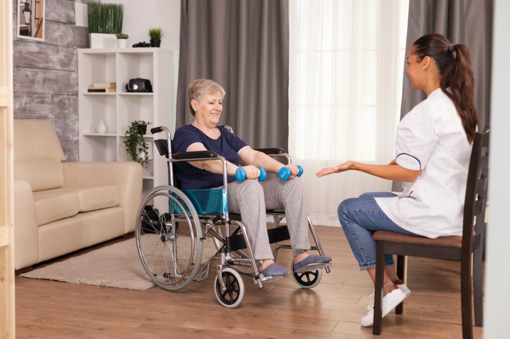 Patient using dumbbells for rehabilitation